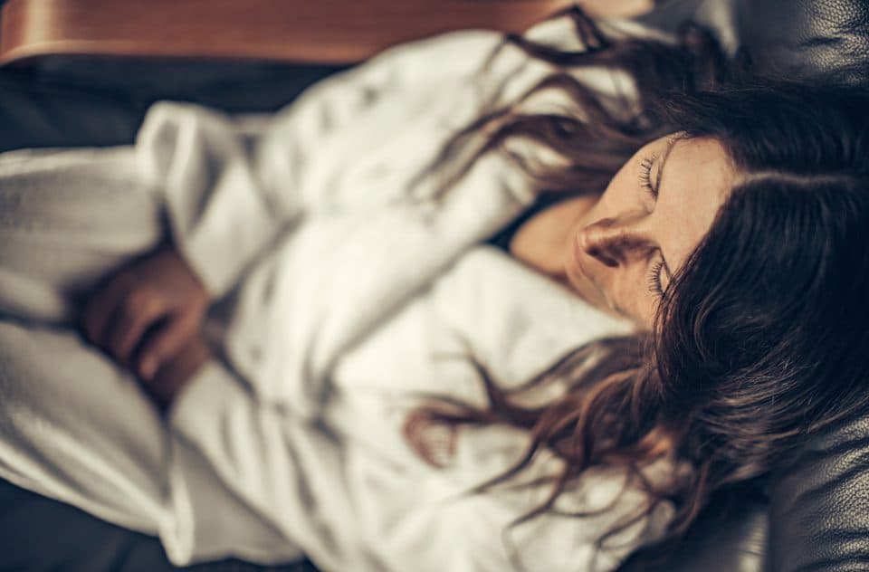 Women experiencing complete bliss in her cozy bathrobe at Scandinave Spa.