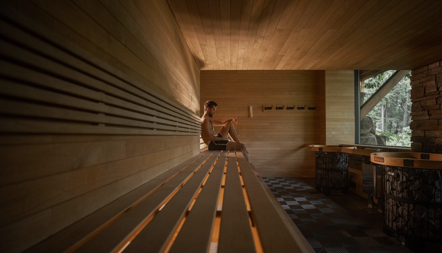 Man relaxing in a sauna enjoying a Scandinave Spa day