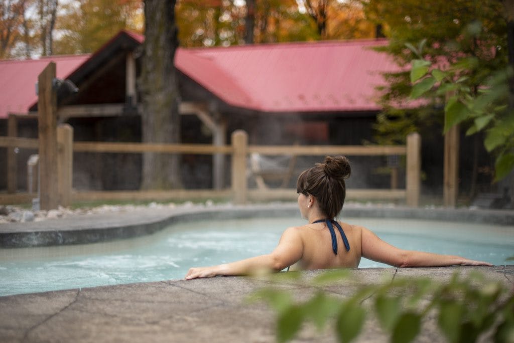 Woman relaxing in outdoor hot Baths