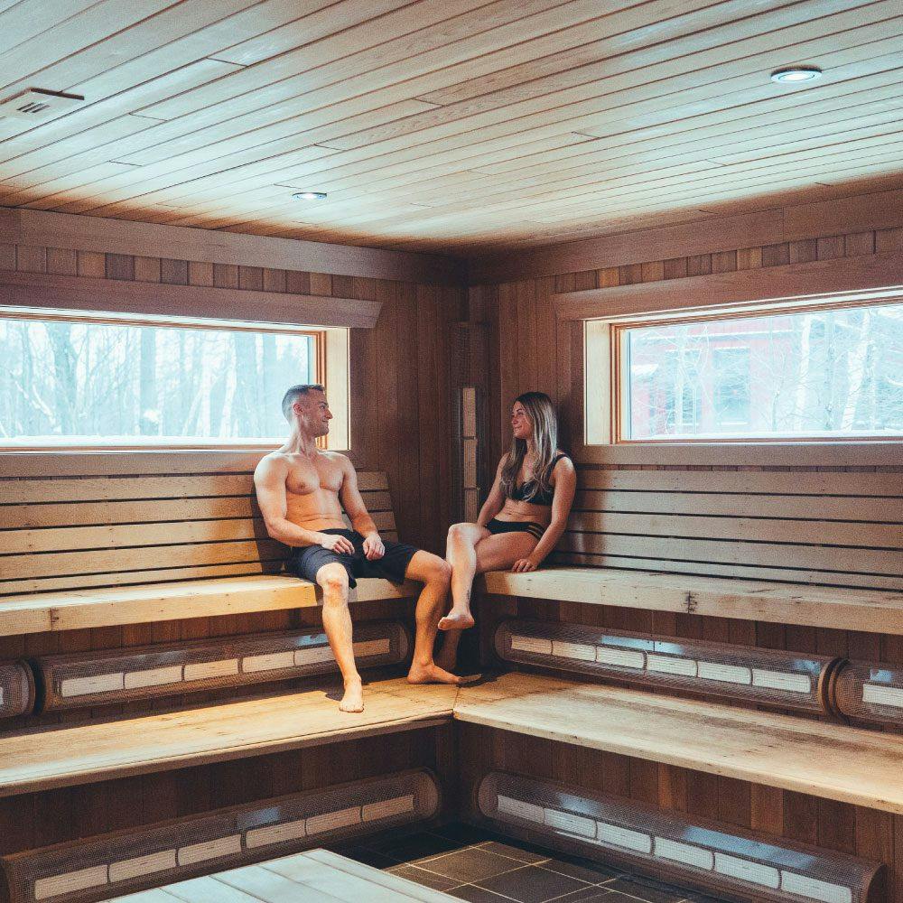 couple relaxing in infrared sauna at Scandinave Spa Blue Mountain.
