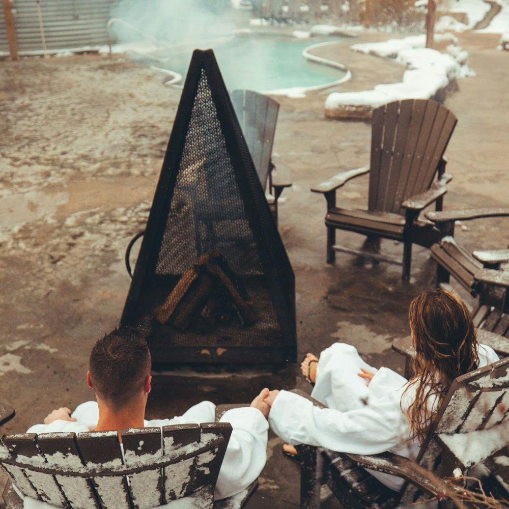 relaxing in front of the fire at Scandinave Spa Blue Mountain.