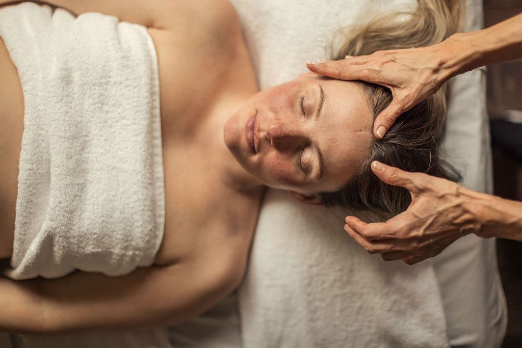 Woman enjoying time for herself during a pregnancy massage at Scandinave Spa Vieux-Montreal