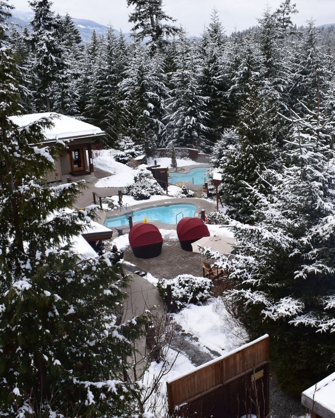 An aerial shot of winter snow over the Scandinave Spa Whistler