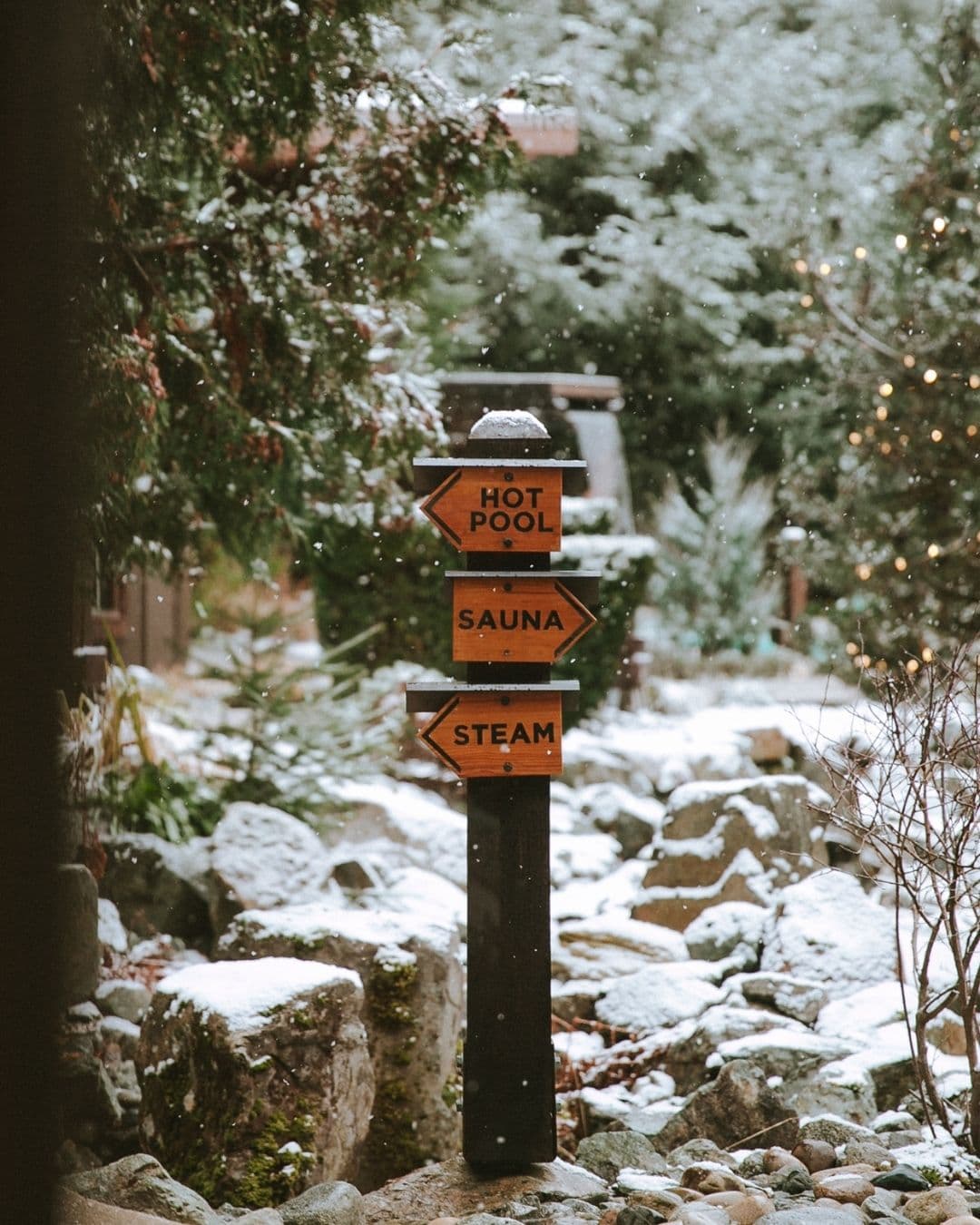 A sign post directing guests to features at the Scandinave Spa Whistler